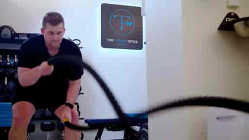 Brenton doing heavy ropes exercises in a private gym studio.