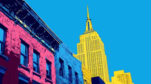Background, full-screen. The Empire State Building soars above a row of Manhattan townhouses.